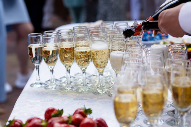 istock A banquet table with wine glasses and plates with strawberries. 1404792363