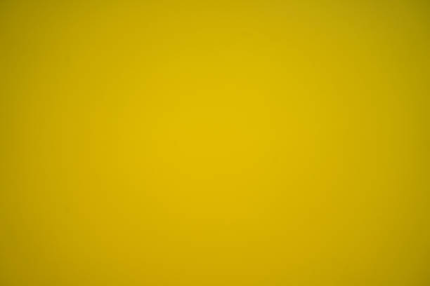 istock The texture of the wall is smooth, yellow or gold. 1404792593