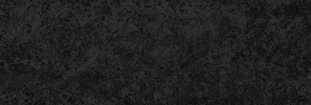istock motley painted plaster wall background 1404794907