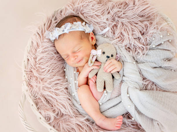 istock newborn baby sleeping in the basket 1404795913