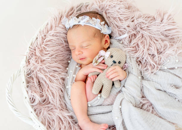 istock newborn baby sleeping in the basket 1404795916