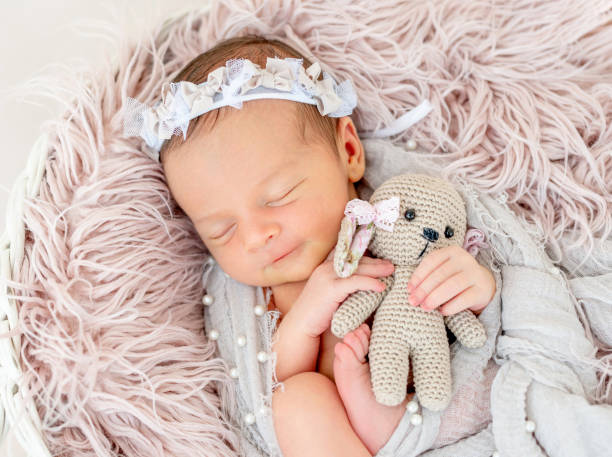 istock newborn baby sleeping in the basket 1404795921