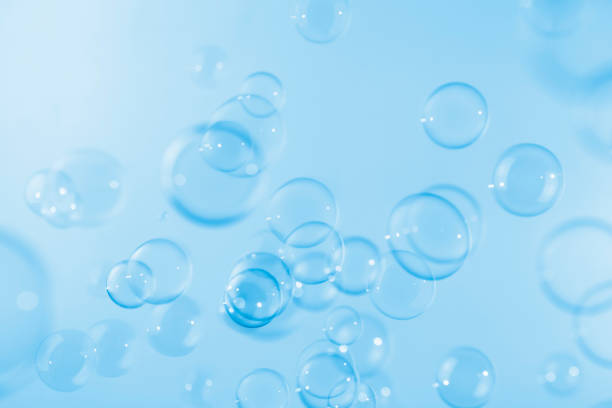 istock Abstract Beautiful Transparent Blue Soap Bubbles Background. Soap Sud Bubbles Water 1404795925