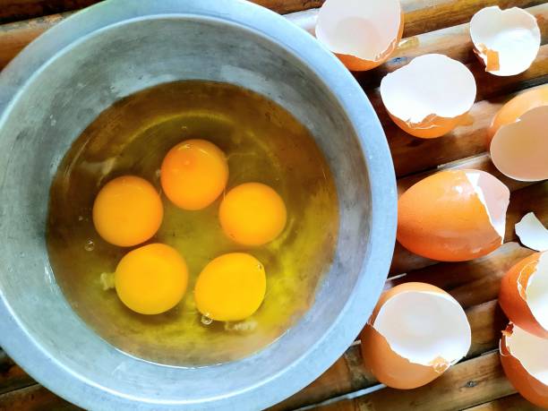 istock Preparing to cook fried eggs - food preparation. 1404797427