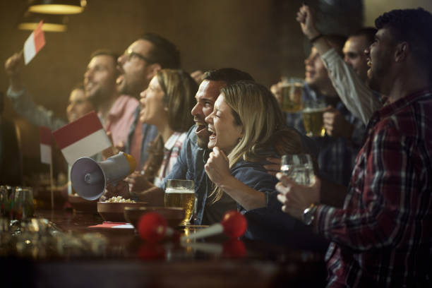 istock Celebrating match victory in a pub! 1404798398