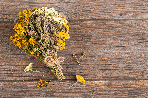 Yarrow ,thyme ,  St. John's wort , on a rustic wooden background