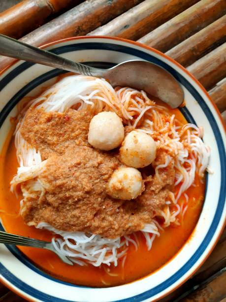 istock Rice noodles and fish curry sauce - Thai food. 1404799521