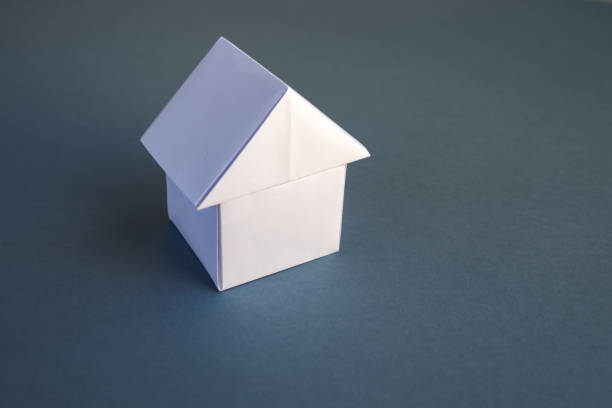 istock White paper house origami isolated on a grey background 1404799669