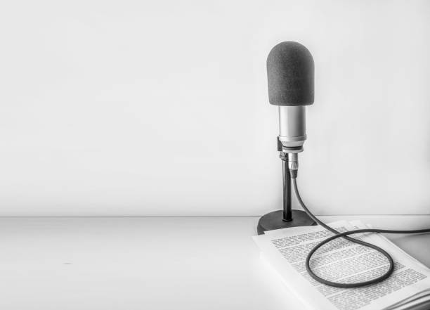 istock professional microphone and text on sheets of paper 1404801132