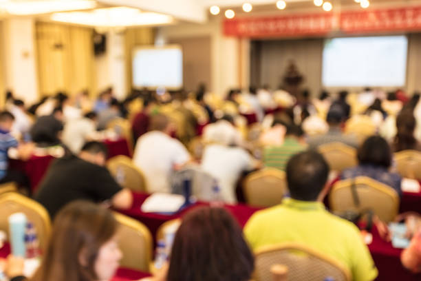 istock Blurred back view of people attending meeting 1404806148