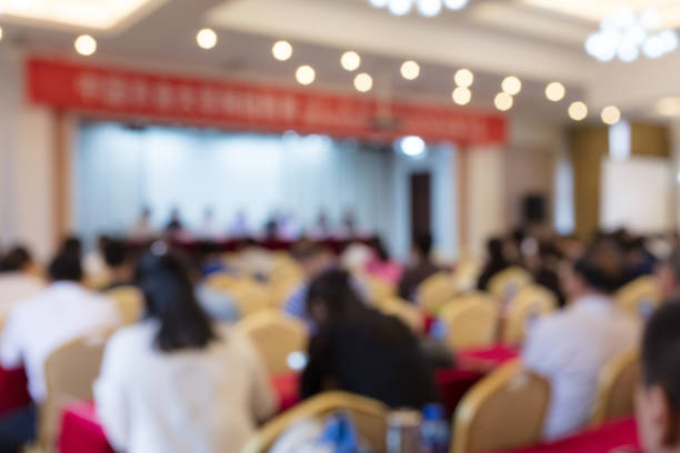 istock Blurred back view of people attending meeting 1404806203