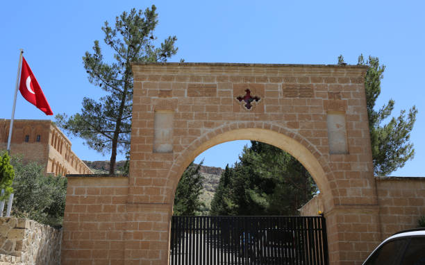 istock Gate of Deyrulzafaran Assyrian Monastery  with Turkish  Flag 1404806433