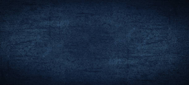 istock Dark blue scratched colorful colored stone concrete paper wall texture structure surface background pattern, with dark vignette 1404807110