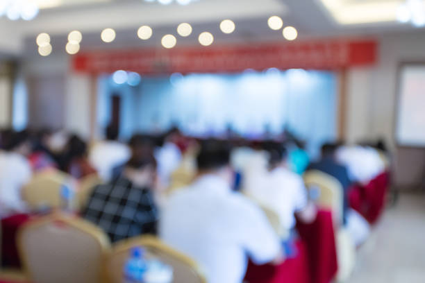 istock Blurred back view of people attending meeting 1404807160
