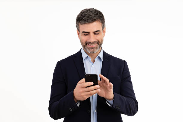 businessman using smart phone on white background - medium shot imagens e fotografias de stock