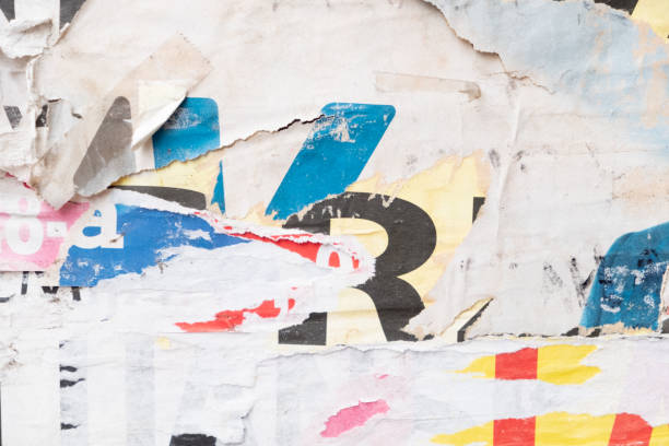 istock Torn street poster background, abstract weathered paper collage with random text 1404808193