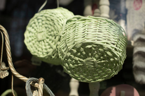 Traditional woven palm fronds decorated with fresh rosemary, roses, and daisies, prepared for the Palm Sunday celebration in Ecuador, symbolize a significant moment in Holy Week
