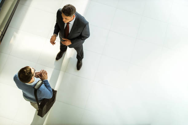 istock Above view of two businessmen talking to each other. 1404808432