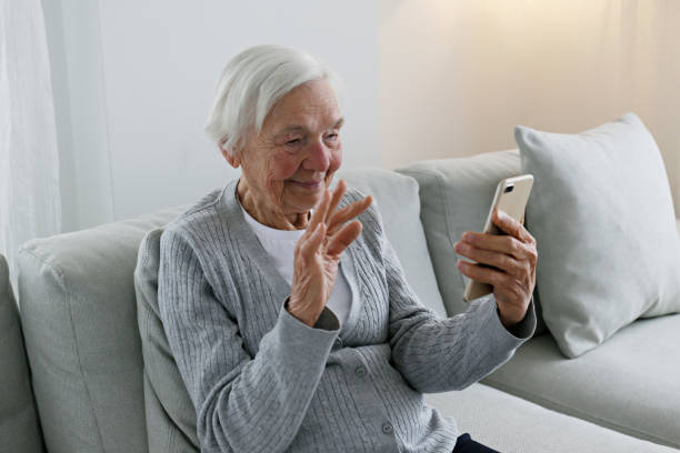 istock Older senior woman with smartphone. 1404809497