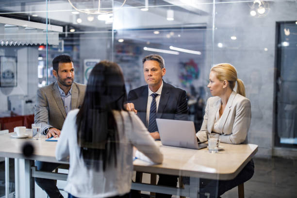 istock Human resource team talking to a candidate on job interview. 1404809535