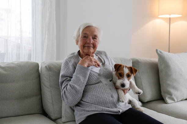 istock Older senior woman with a dog. 1404809555
