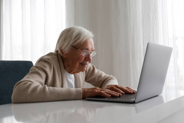 istock Older senior woman with laptop. 1404809666