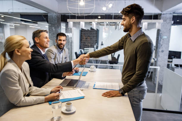 istock Happy candidate greeting member of human resource team on job interview. 1404809679
