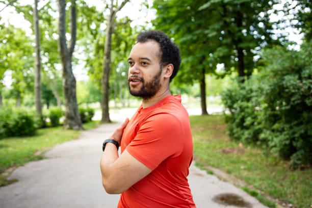 istock Young muscular man doing stretching exercises 1404810825