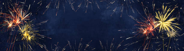 istock Silvester 2022 New year background banner panorama long- firework fireworks on rustic dark blue night sky texture 1404811761