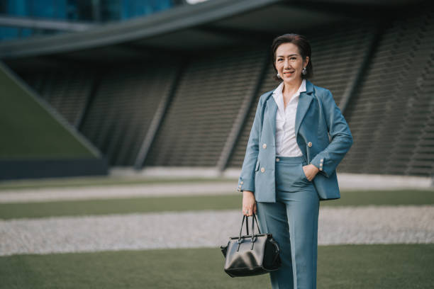 istock successful Asian Chinese female entrepreneur looking at camera smiling 1404812284