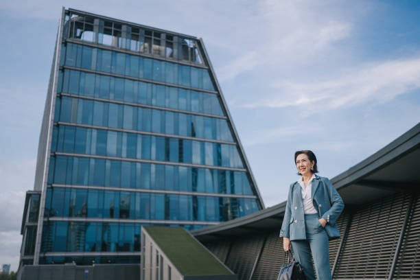 istock successful Asian Chinese female entrepreneur looking at camera smiling 1404812288