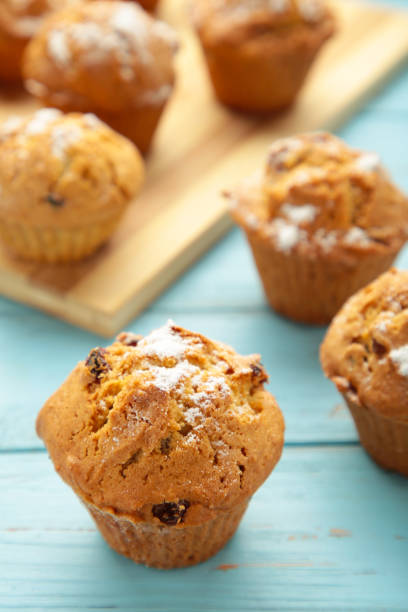 istock Vanilla muffins. Sweet cupcakes on blue background. 1404812517