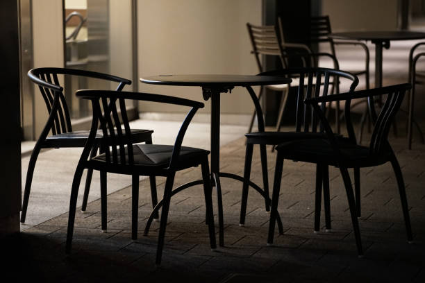 Night view of outdoor cafe tables and chairs
