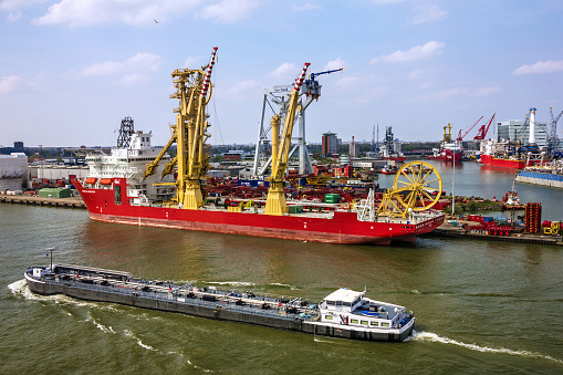 Rotterdam, Netherlands - June 24, 2022:  cargo vessels in sea port