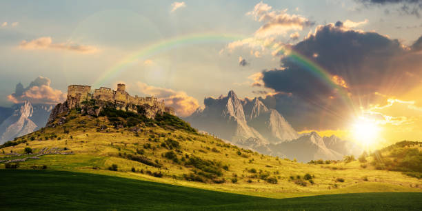 istock castle on the hill beneath a rainbow at sunset 1404812783