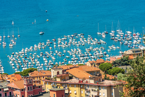 Aerial view of the port of Lerici town with many recreational boats moored, Tourist resort on the coast of Gulf of La Spezia, Liguria, Mediterranean sea (Ligurian Sea), Italy, Europe.