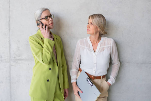 istock Woman talking on phone while her partner waiting her 1404818063