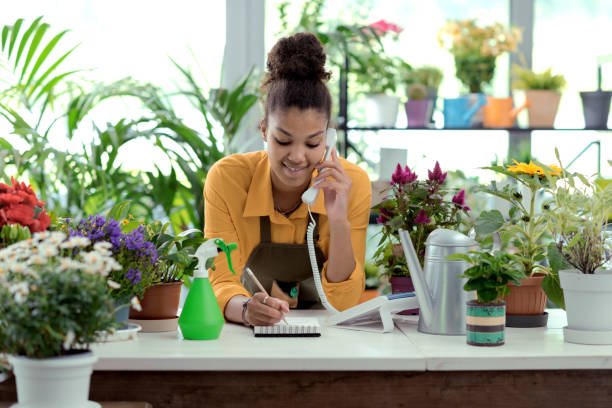istock Florist taking orders over the phone 1404822175