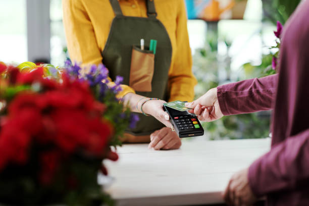 istock Customer paying with a credit card 1404822830