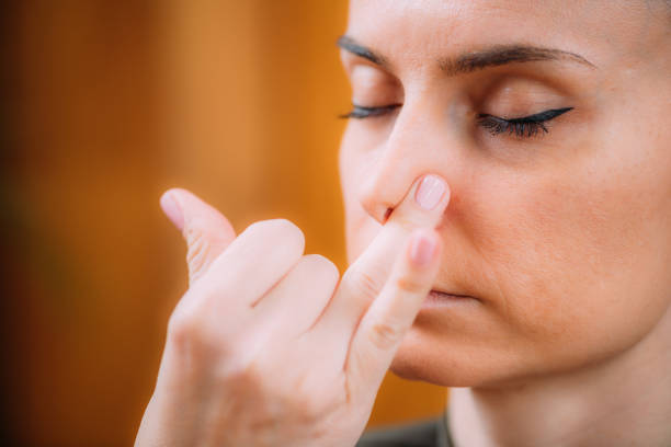 Nadi Shodhana Pranayama, Alternate Nostril Breathing, Kapalabhati. Nadi Shodhana Pranayama, Alternate Nostril Breathing, Kapalabhati breath vapor stock pictures, royalty-free photos & images