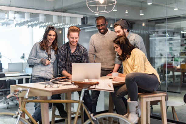 istock Happy freelance workers working on laptop in the office. 1404826171