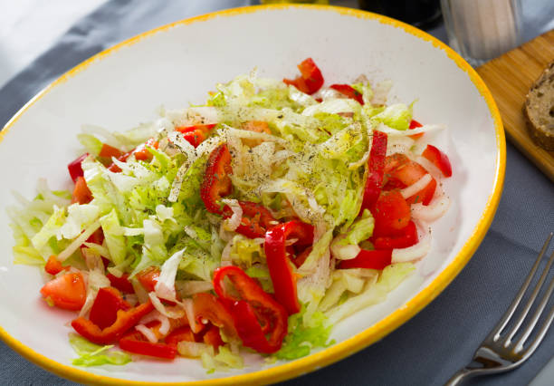 istock Salad with red bell peppers, lettuce and onions 1404827182