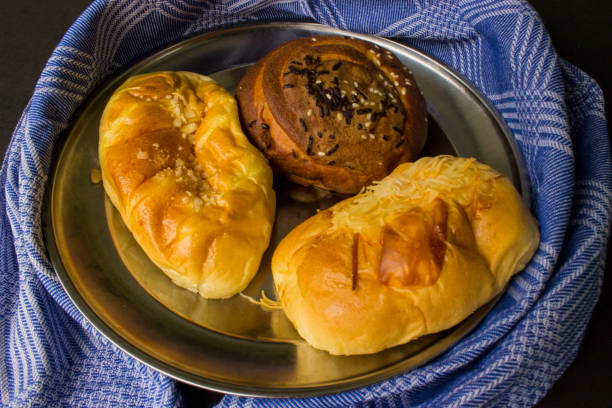 istock Baking Homemade bread Pastry chocolate, isolated on black background suitable for breakfast 1404827587