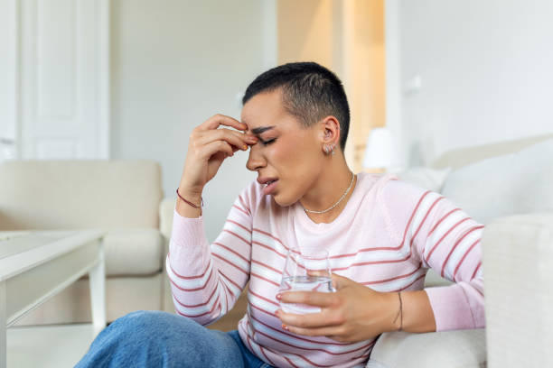 istock Sinus ache causing very paintful headache. Unhealthy woman in pain. Sharp strong sore. Sinus pain, sinus pressure, sinusitis. Sad woman holding her head because sinus pain 1404827706