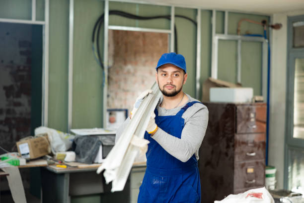 istock Master holds an aluminum profile for interior decoration 1404827847