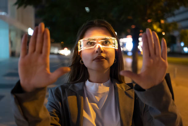 istock Young woman with augmanted reality glasses 1404830170