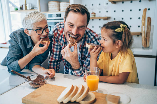 Happy family having breakfast.