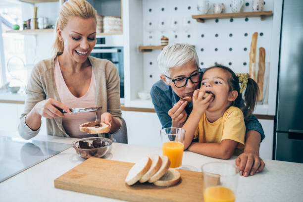 istock Happy family having breakfast. 1404832214