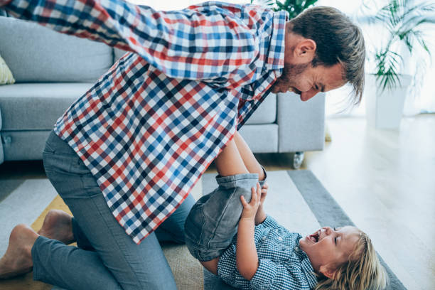istock Father and little son at home. 1404832217