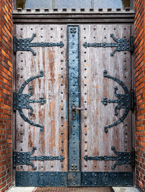Ancient wooden carved door of a gothic church Ancient carved wooden door of a medieval cathedral crypts stock pictures, royalty-free photos & images